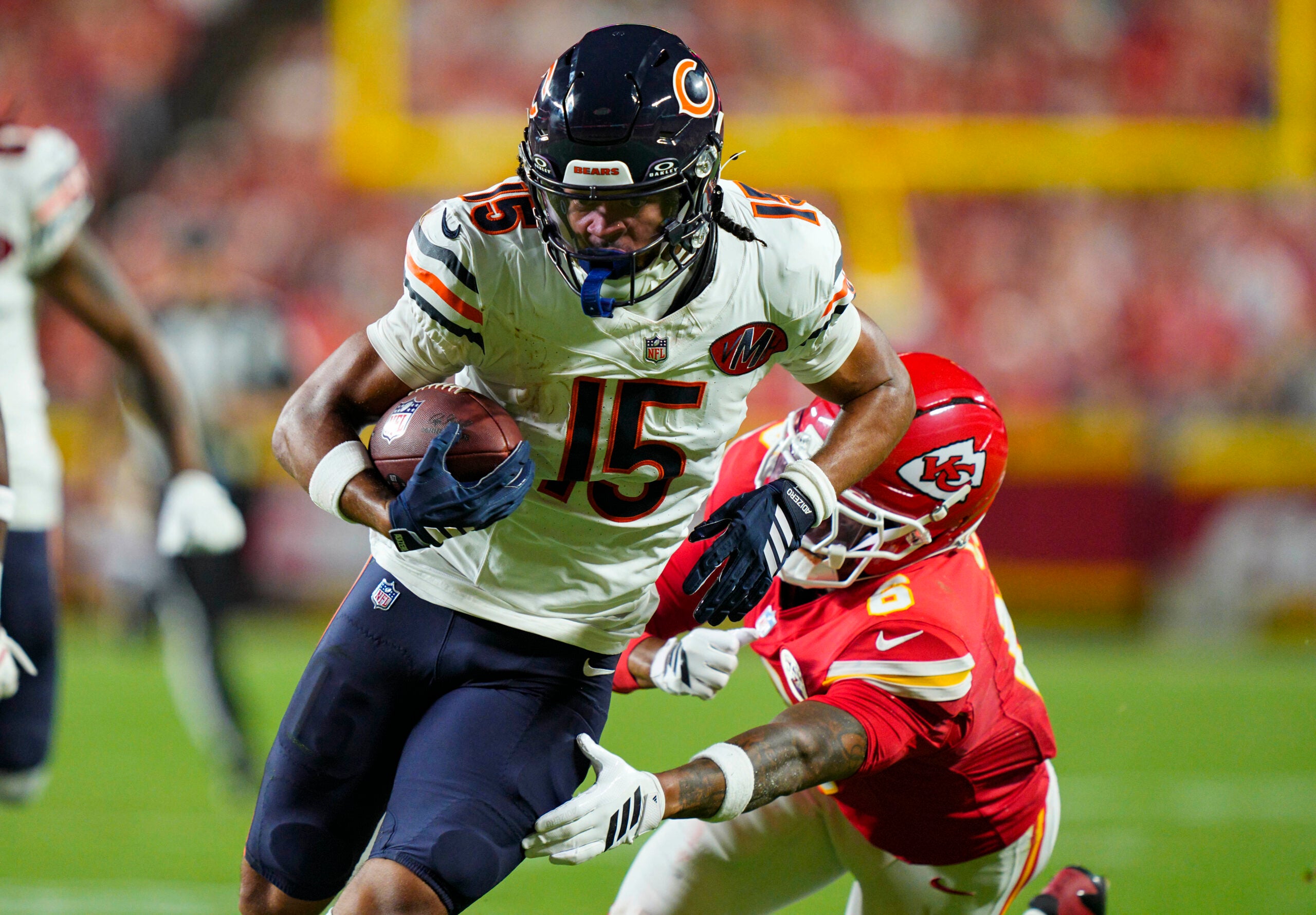 Aug 22, 2025; Kansas City, Missouri, USA; Chicago Bears wide receiver Rome Odunze (15) runs with the ball against Kansas City Chiefs safety Bryan Cook (6) during the first half at GEHA Field at Arrowhead Stadium.