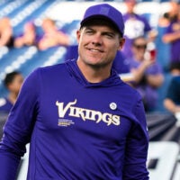 Aug 22, 2025; Nashville, Tennessee, USA; Minnesota Vikings head coach Kevin O'Connell walks to the field against the Tennessee Titan during the first half at Nissan Stadium.
