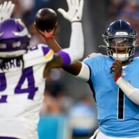 Tennessee Titans quarterback Cam Ward (1) throws the ball over Minnesota Vikings safety Jay Ward (24) during the first quarter of an NFL pre-season game at Nissan Stadium in Nashville, Tenn., Friday, Aug. 22, 2025.