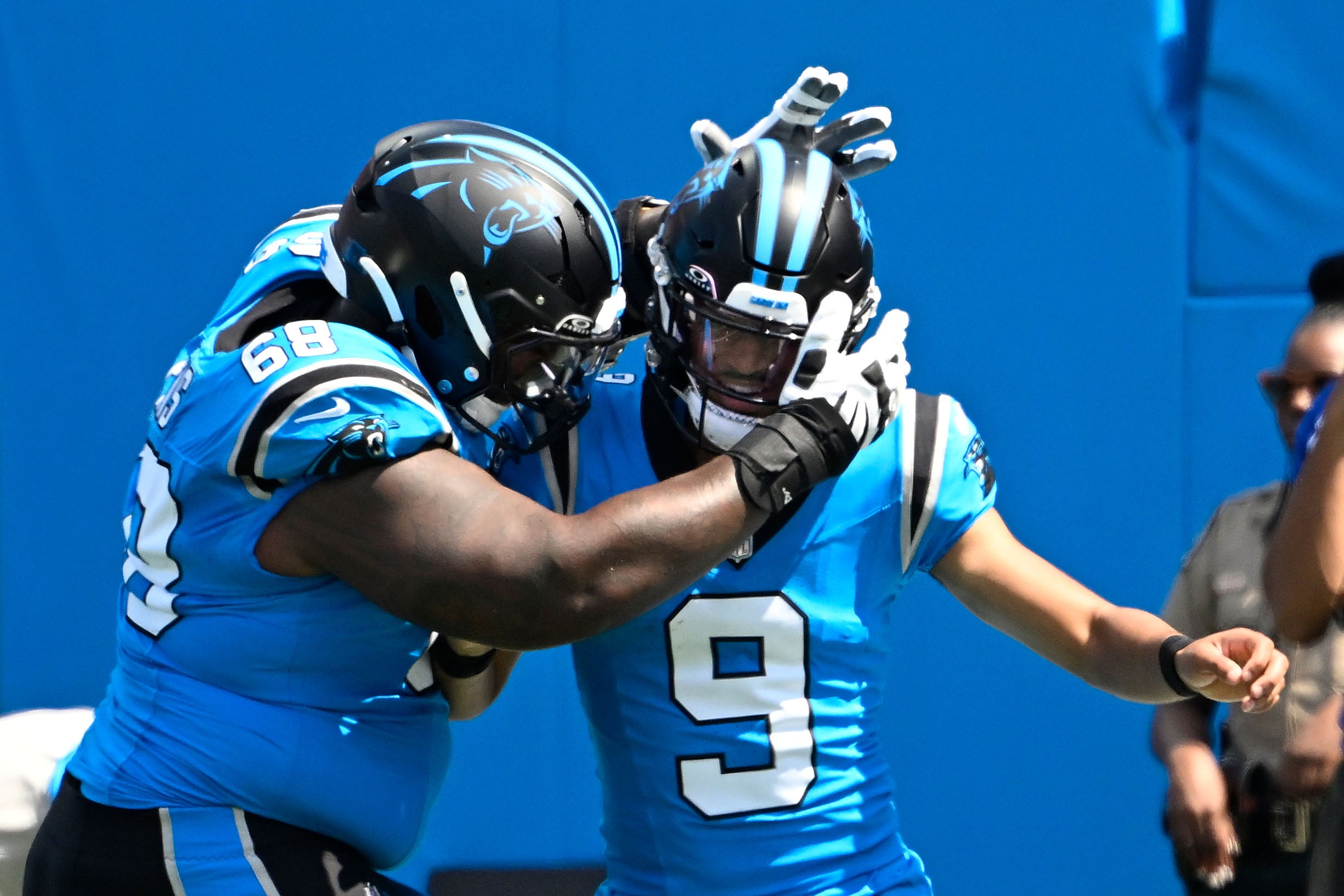 Sep 21, 2025; Charlotte, North Carolina, USA; Carolina Panthers quarterback Bryce Young (9) celebrates with guard Damien Lewis (68) after scoring a touchdown in the first quarter at Bank of America Stadium.