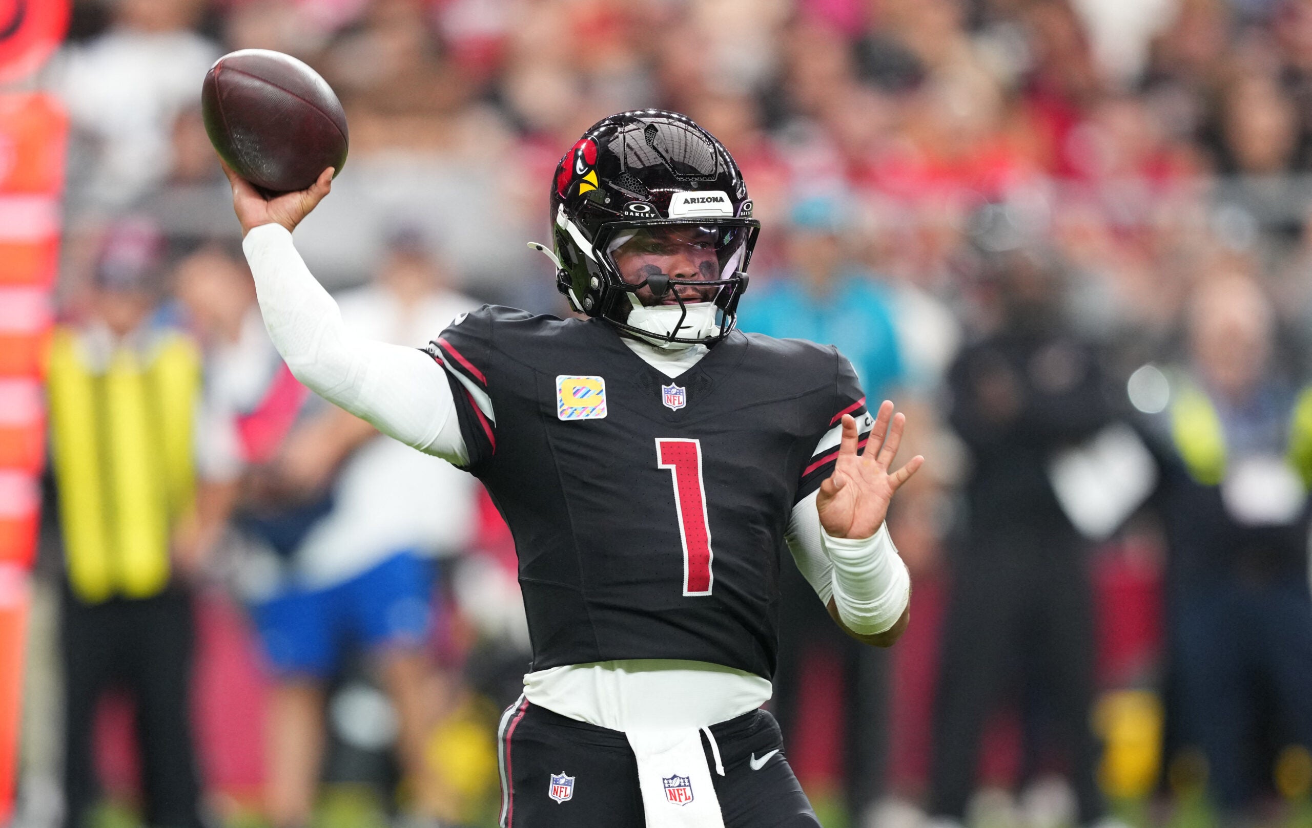 Oct 5, 2025; Glendale, Arizona, USA; Arizona Cardinals quarterback Kyler Murray (1) makes a throw against the Tennessee Titans during the fourth quarter at State Farm Stadium.