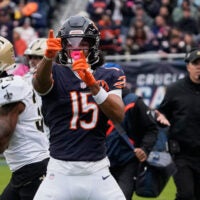 Oct 19, 2025; Chicago, Illinois, USA; Chicago Bears wide receiver Rome Odunze (15) and New Orleans Saints head coach Kellen Moore react after a Chicago first down during the first half at Soldier Field.