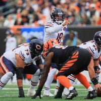 Nov 2, 2025; Cincinnati, Ohio, USA; Chicago Bears quarterback Caleb Williams (18) gestures toward the Cincinnati Bengals defense at the line of scrimmage during the first quarter at Paycor Stadium.