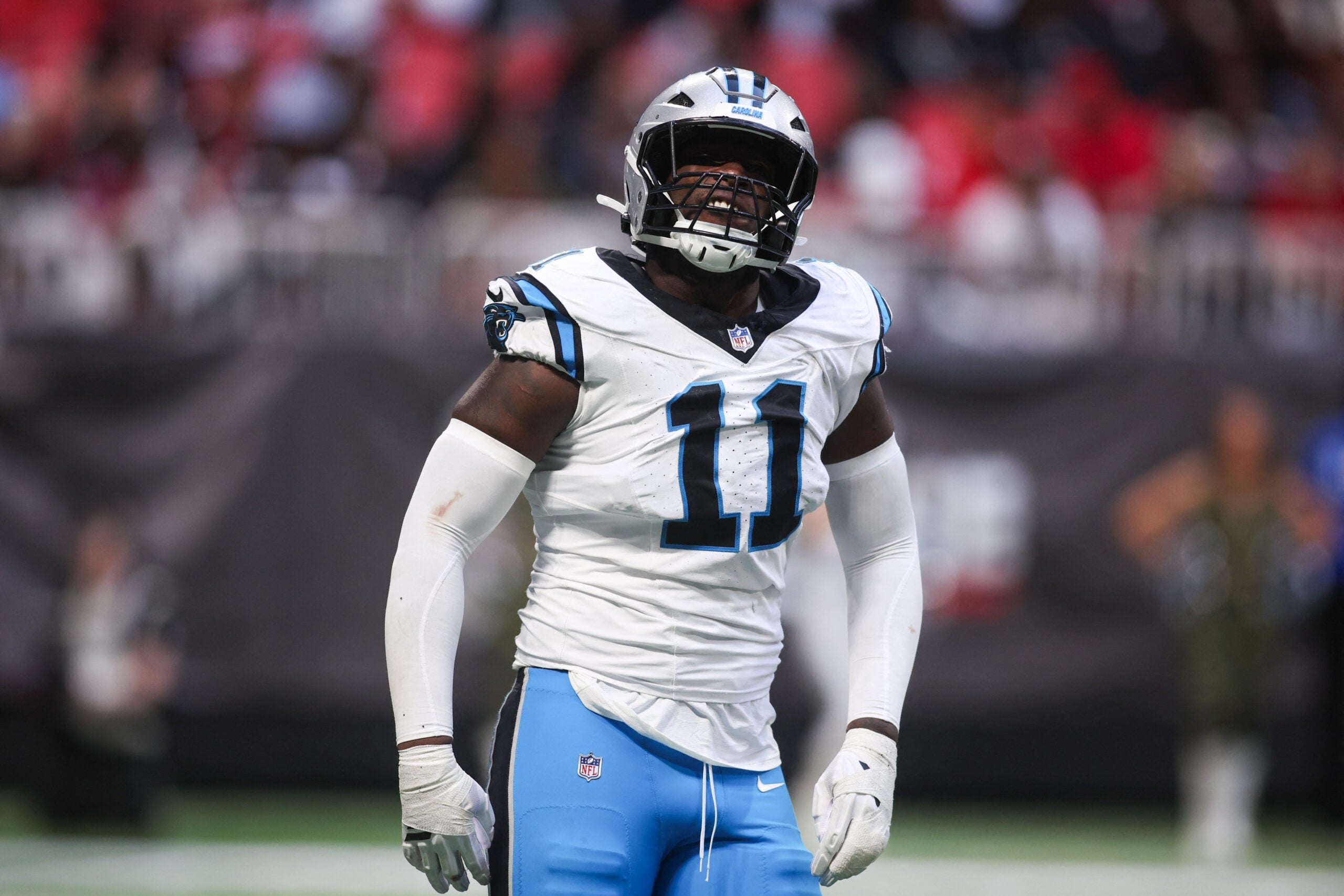 Nov 16, 2025; Atlanta, Georgia, USA; Carolina Panthers outside linebacker Nic Scourton (11) reacts after a play in the fourth quarter against the Atlanta Falcons at Mercedes-Benz Stadium.