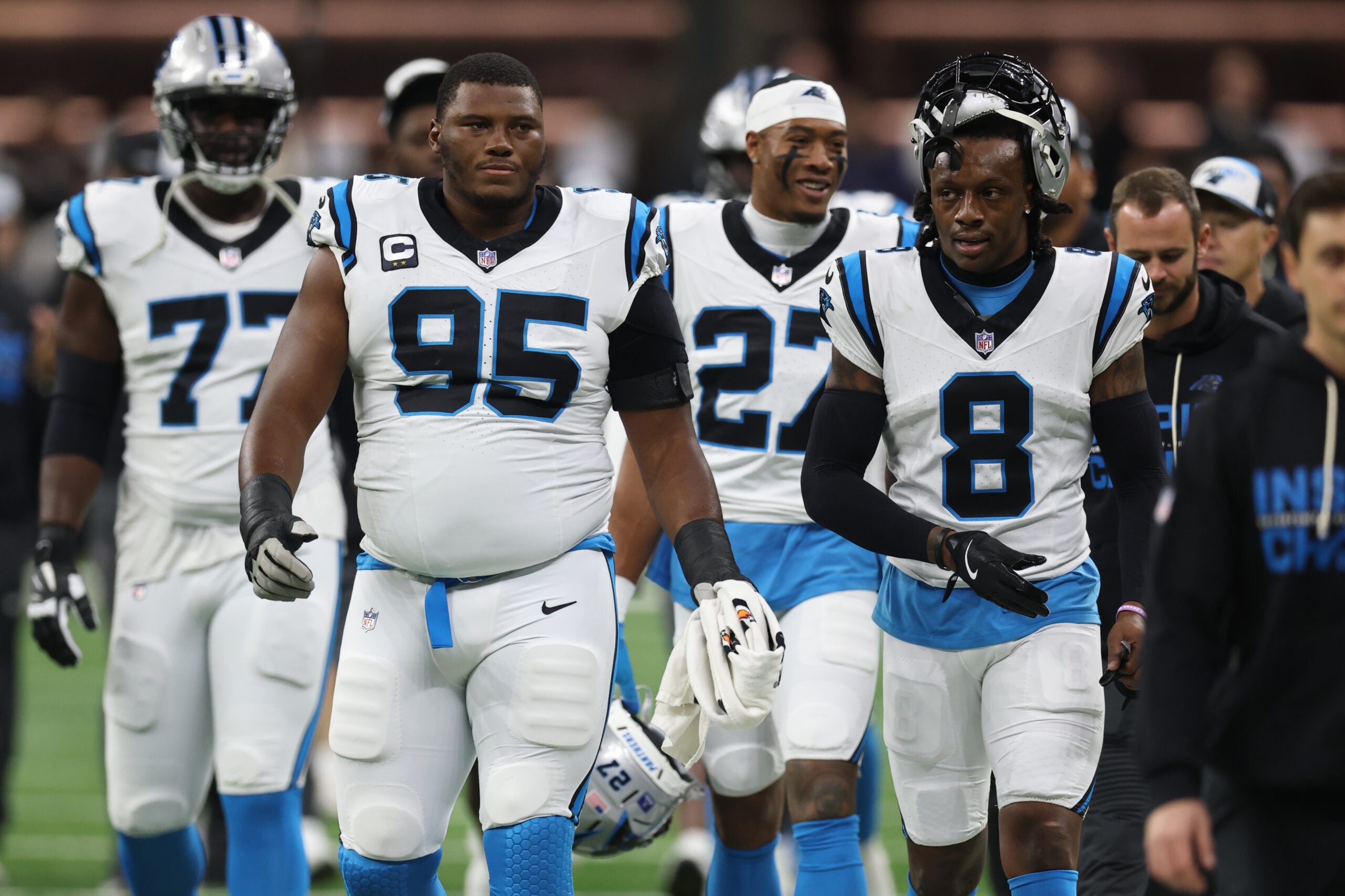 Dec 14, 2025; New Orleans, Louisiana, USA; Carolina Panthers defensive end Derrick Brown (95) and cornerback Jaycee Horn (8) walk on the field before the game against the New Orleans Saints at Caesars Superdome.