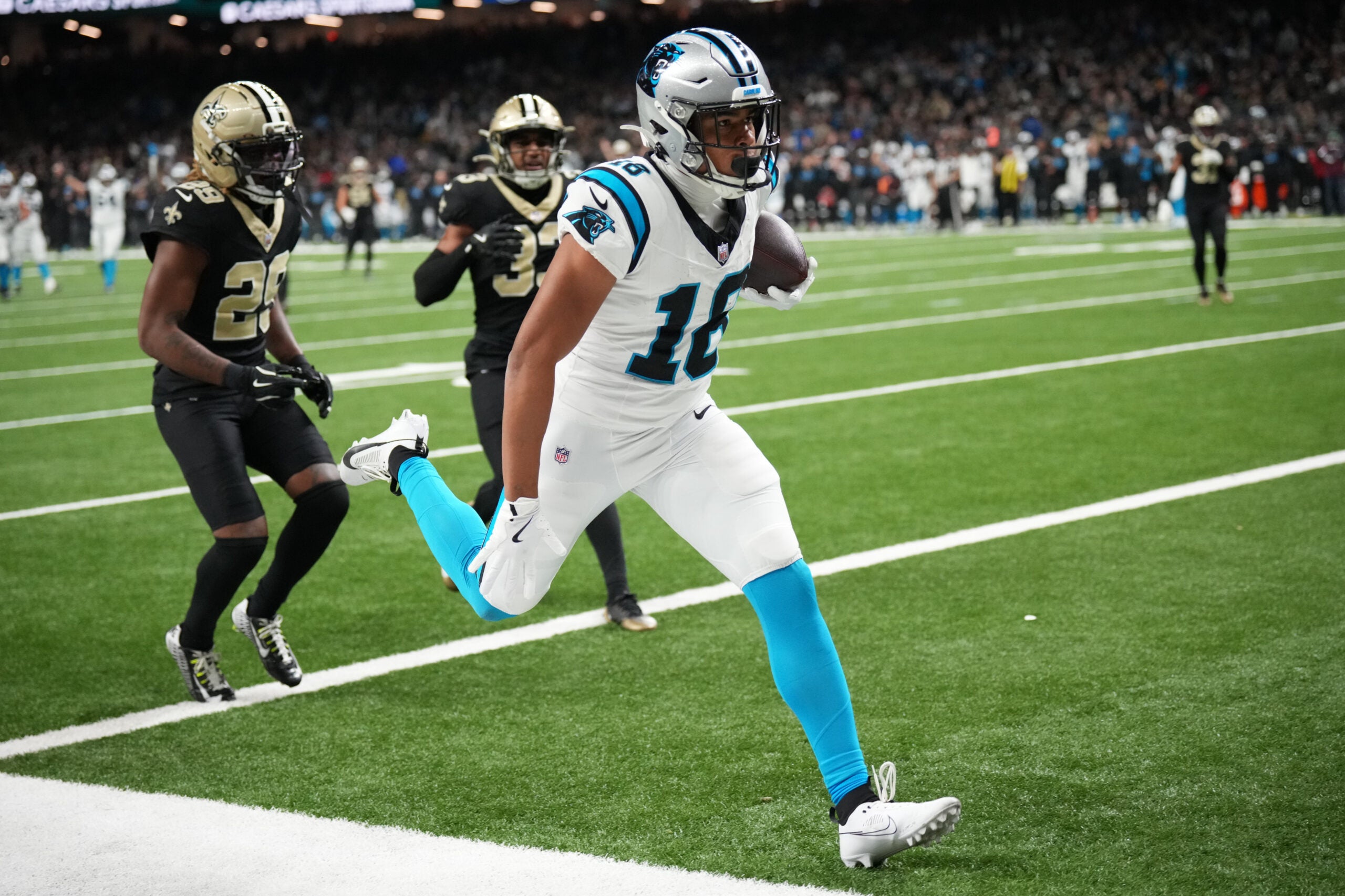 Dec 14, 2025; New Orleans, Louisiana, USA; Carolina Panthers wide receiver Jalen Coker (18) scores a touchdown in the third quarter against the New Orleans Saints at Caesars Superdome.