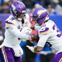Minnesota Vikings quarterback J.J. McCarthy (9) gives the ball too Minnesota Vikings running back Zavier Scott (36) during a game against the New York Giants at MetLife Stadium, Dec 21, 2025, East Rutherford, NJ, USA