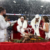 Dec 25, 2025; Minneapolis, Minnesota, USA; Minnesota Vikings cornerback Byron Murphy Jr. (7) and linebacker Andrew van Ginkel (43) are interviewed by WWE Superstar wrestler Seth Rollins and Dianna Russini after the game against the Detroit Lions at U.S. Bank Stadium.