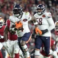 Dec 28, 2025; Santa Clara, California, USA; Chicago Bears running back D'Andre Swift (4) scores a touchdown against the San Francisco 49ers in the second half at Levi's Stadium.