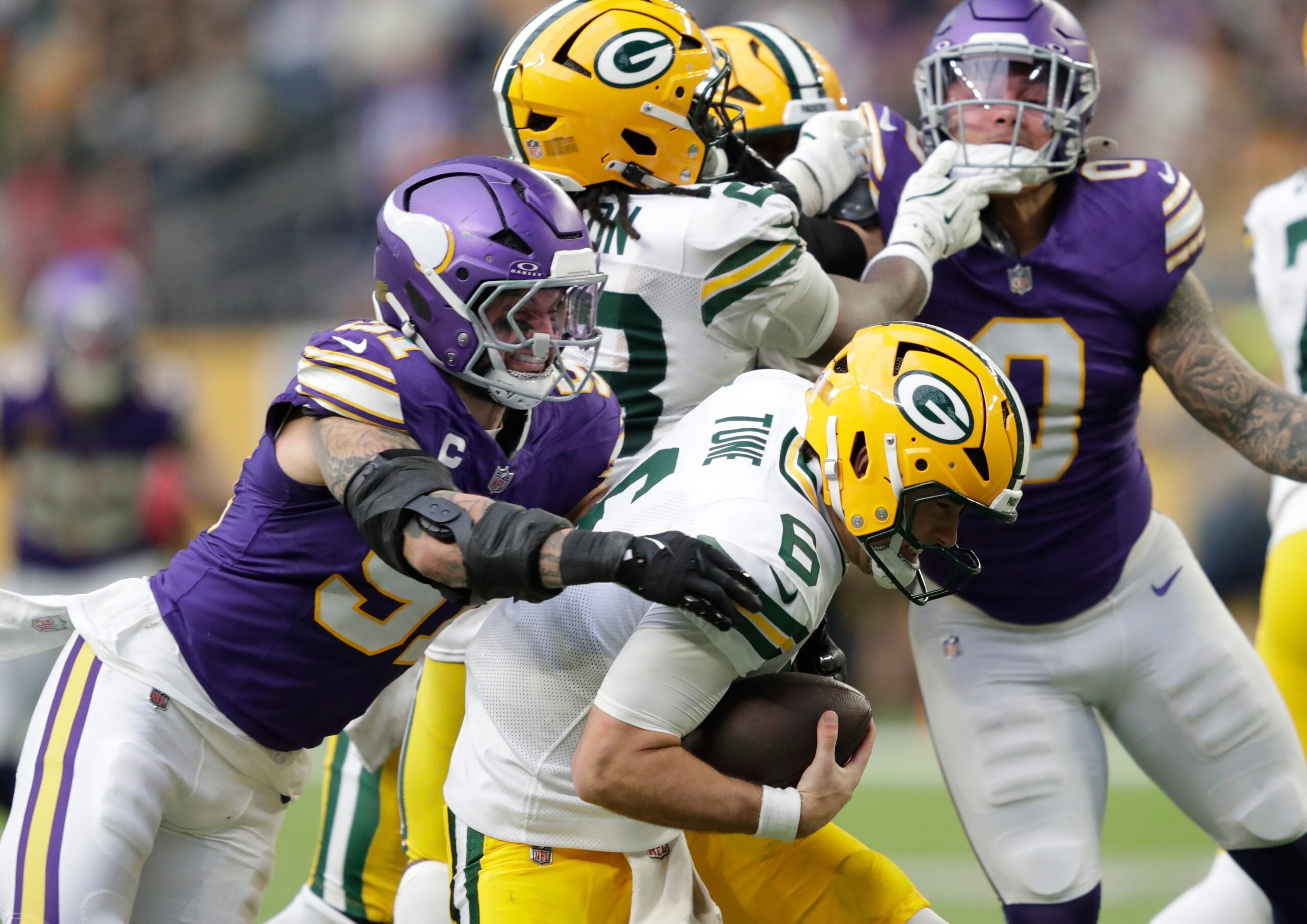 Minnesota Vikings linebacker Blake Cashman (51) sacks Green Bay Packers quarterback Clayton Tune (6) during their football game Sunday, January 4, 2026, at U.S. Bank Stadium in Minneapolis, Minnesota.