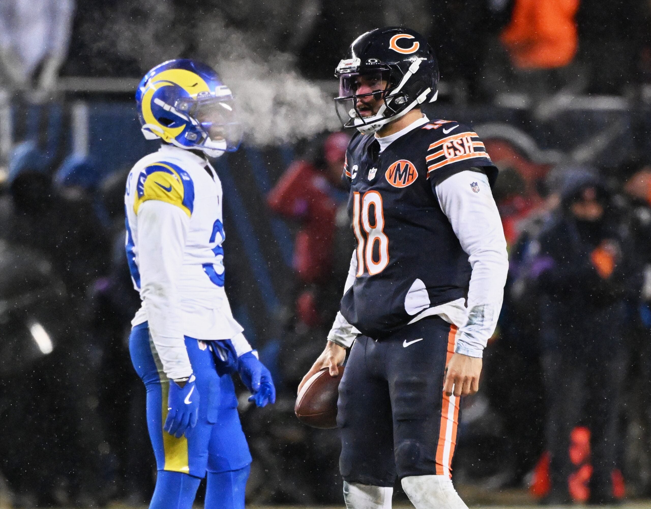 Jan 18, 2026; Chicago, IL, USA; Chicago Bears quarterback Caleb Williams (18) reacts to a first down against the Los Angeles Rams during the fourth quarter of an NFC Divisional Round game at Soldier Field.