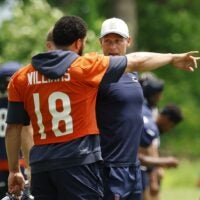 Jun 9, 2026; Lake Forest, IL, USA; Chicago Bears quarterback Caleb Williams (18) talks with head coach Ben Johnson during Minicamp at Halas Hall.