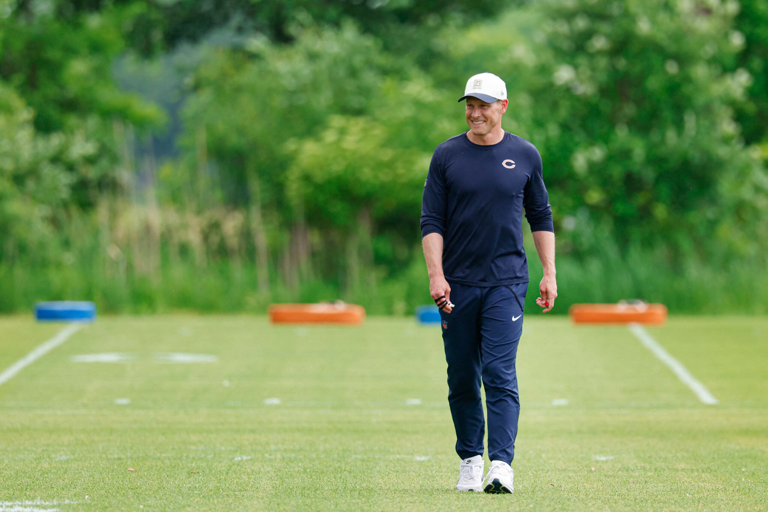 Jun 9, 2026; Lake Forest, IL, USA; Chicago Bears head coach Ben Johnson walks on the field during Chicago Bears Minicamp at Halas Hall.