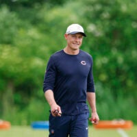 Jun 9, 2026; Lake Forest, IL, USA; Chicago Bears head coach Ben Johnson walks on the field during Chicago Bears Minicamp at Halas Hall.