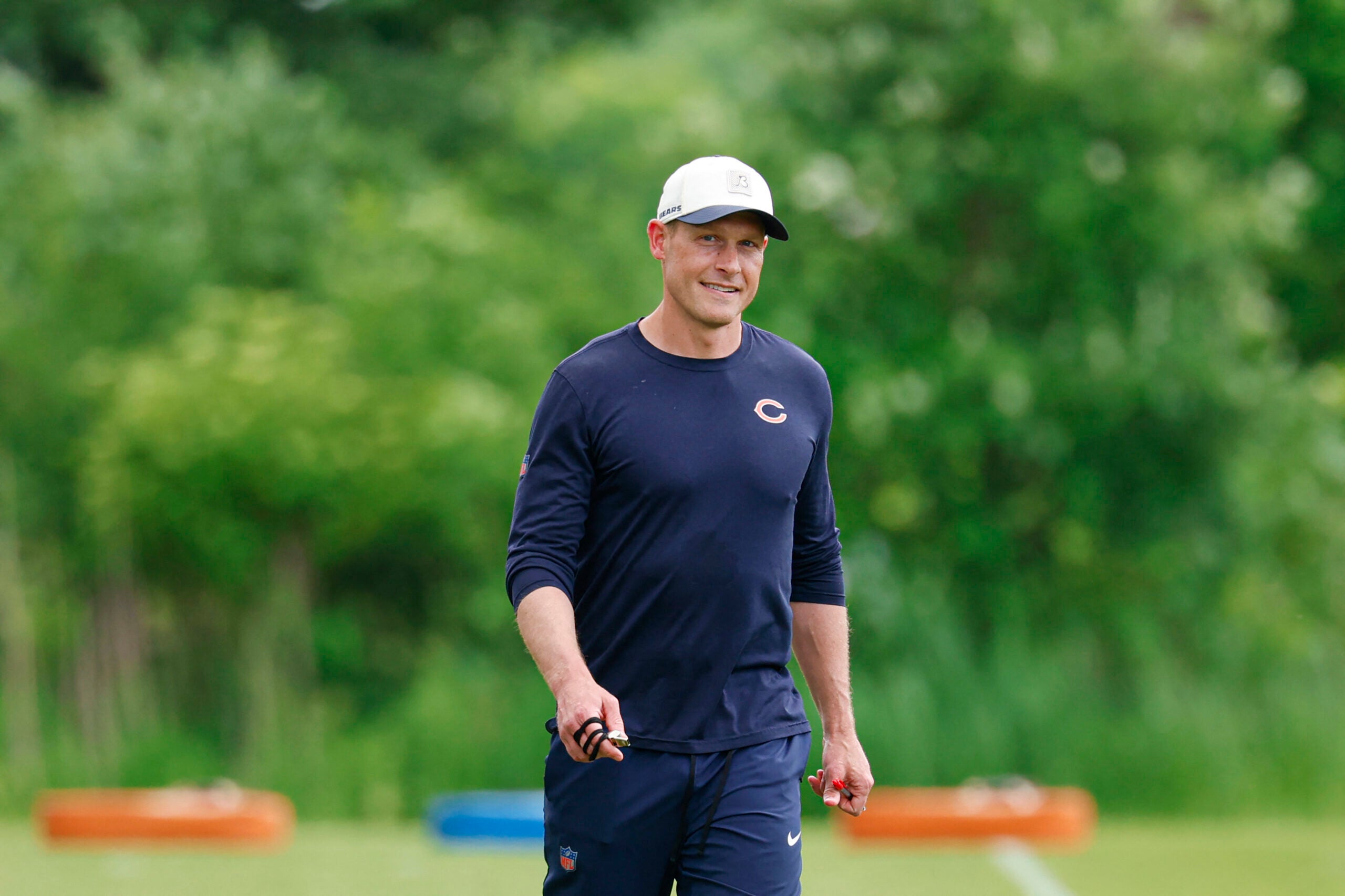 Jun 9, 2026; Lake Forest, IL, USA; Chicago Bears head coach Ben Johnson walks on the field during Chicago Bears Minicamp at Halas Hall.