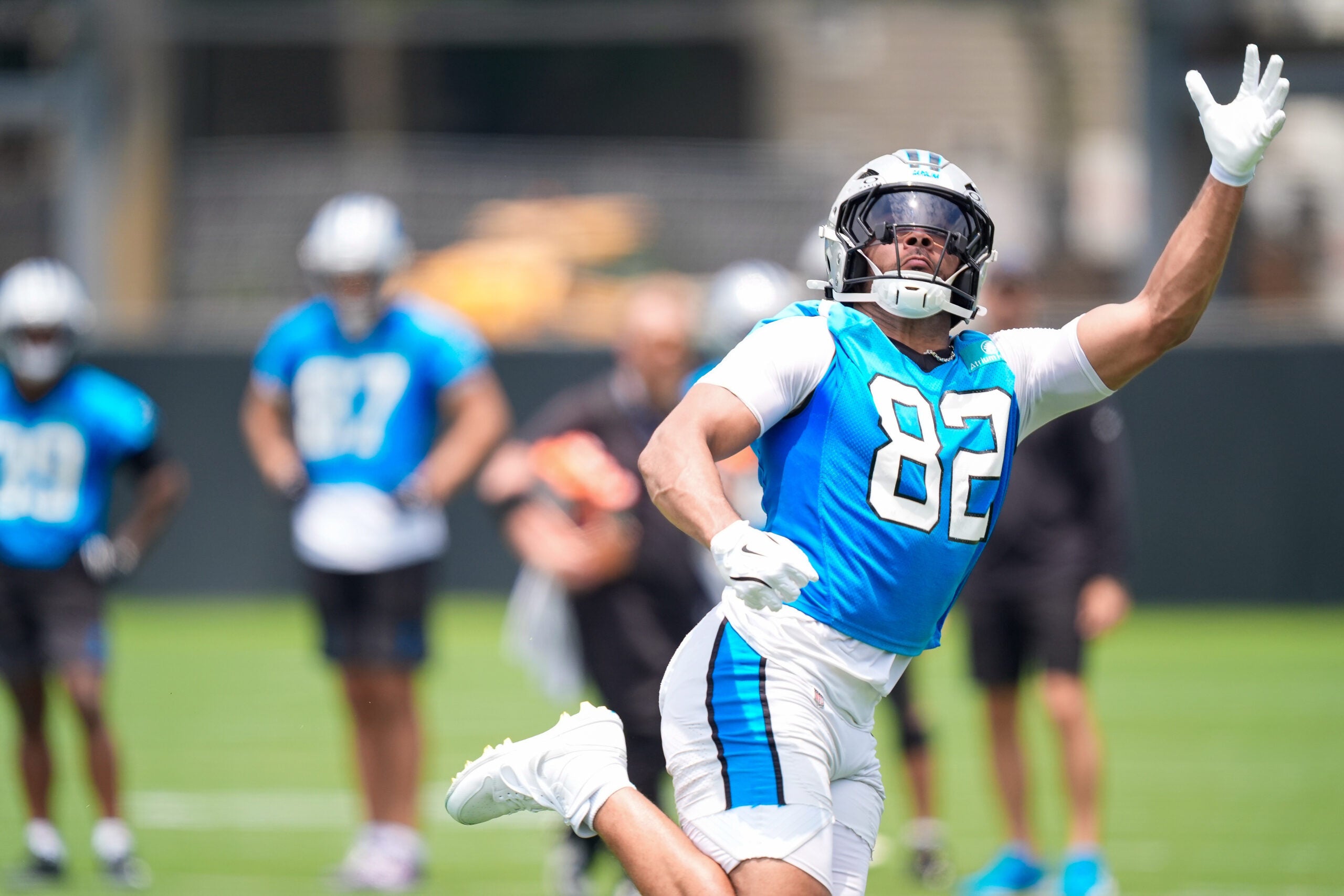 Jun 9, 2026; Charlotte, NC, USA; Carolina Panthers tight end Tommy Tremble (82) stretches for a catch during the first day of mini camp at Bank of America Stadium practice facility.