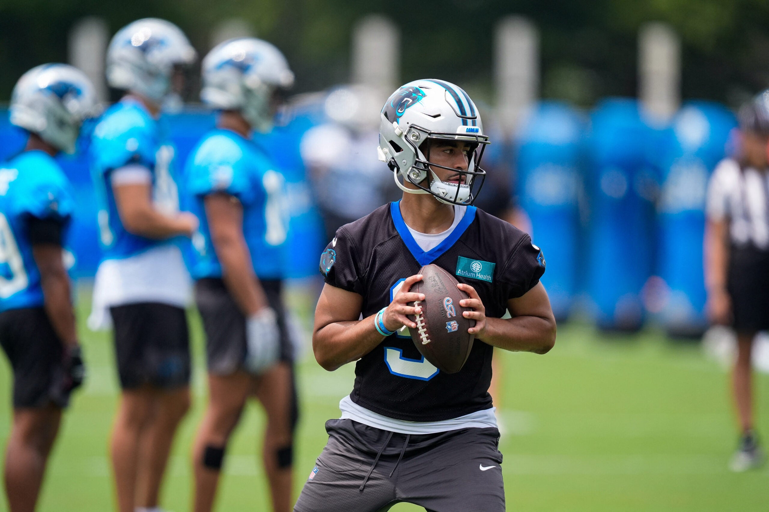 Jun 9, 2026; Charlotte, NC, USA; Carolina Panthers quarterback Bryce Young (9) looks for his receiver during the first day of mini camp at Bank of America Stadium practice facility.
