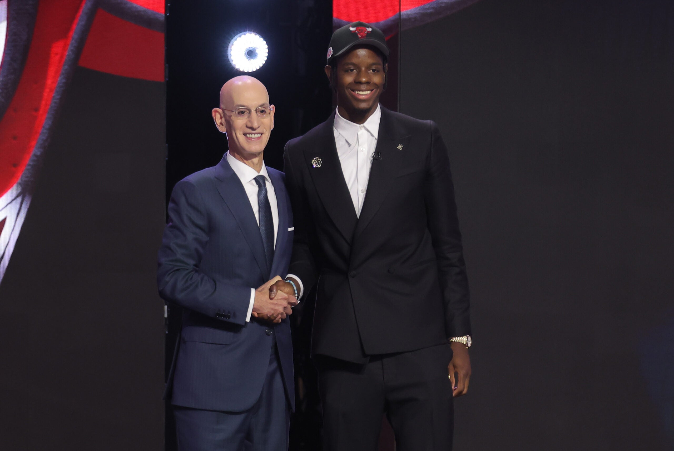 Jun 23, 2026; New York, NY, USA; NBA commissioner Adam Silver greets the fourth pick in the 2026 NBA draft, North Carolina forward Caleb Wilson after he was selected by the Chicago Bulls at Barclays Center.