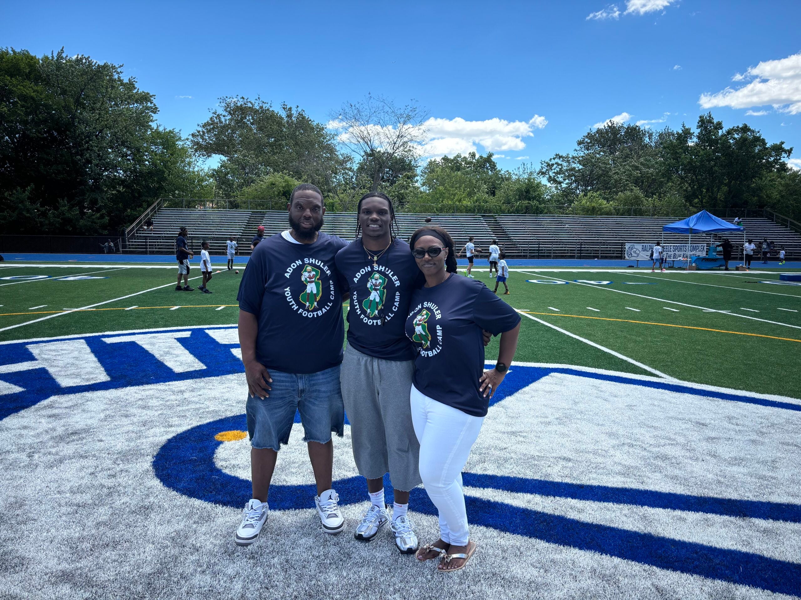 Notre Dame safety Adon Shuler and his parents, Don and Fran, at his annual youth football camp