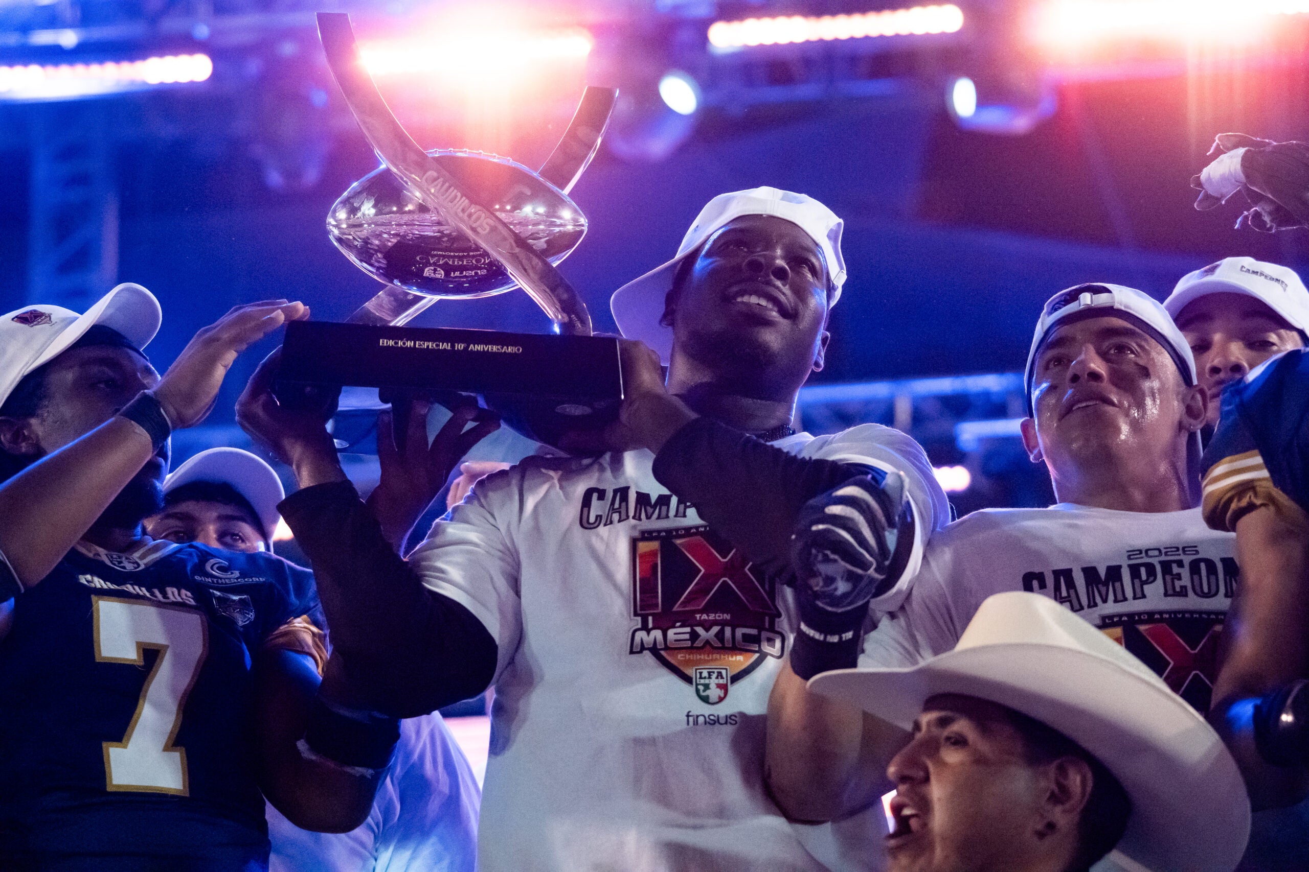 Former Auburn Tigers quarterback Jeremy Johnson lifts the trophy after winning his third Mexico Bowl (LFA Championship) playing for the Chihuahua Caudillos.