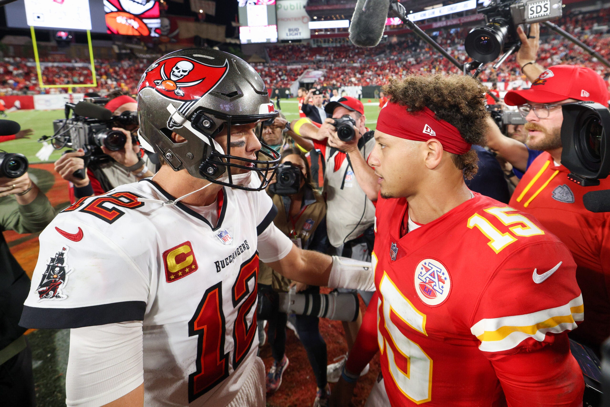 Oct 2, 2022; Tampa, Florida, USA; Tampa Bay Buccaneers quarterback Tom Brady (12) greets Kansas City Chiefs quarterback Patrick Mahomes (15) after a game at Raymond James Stadium.