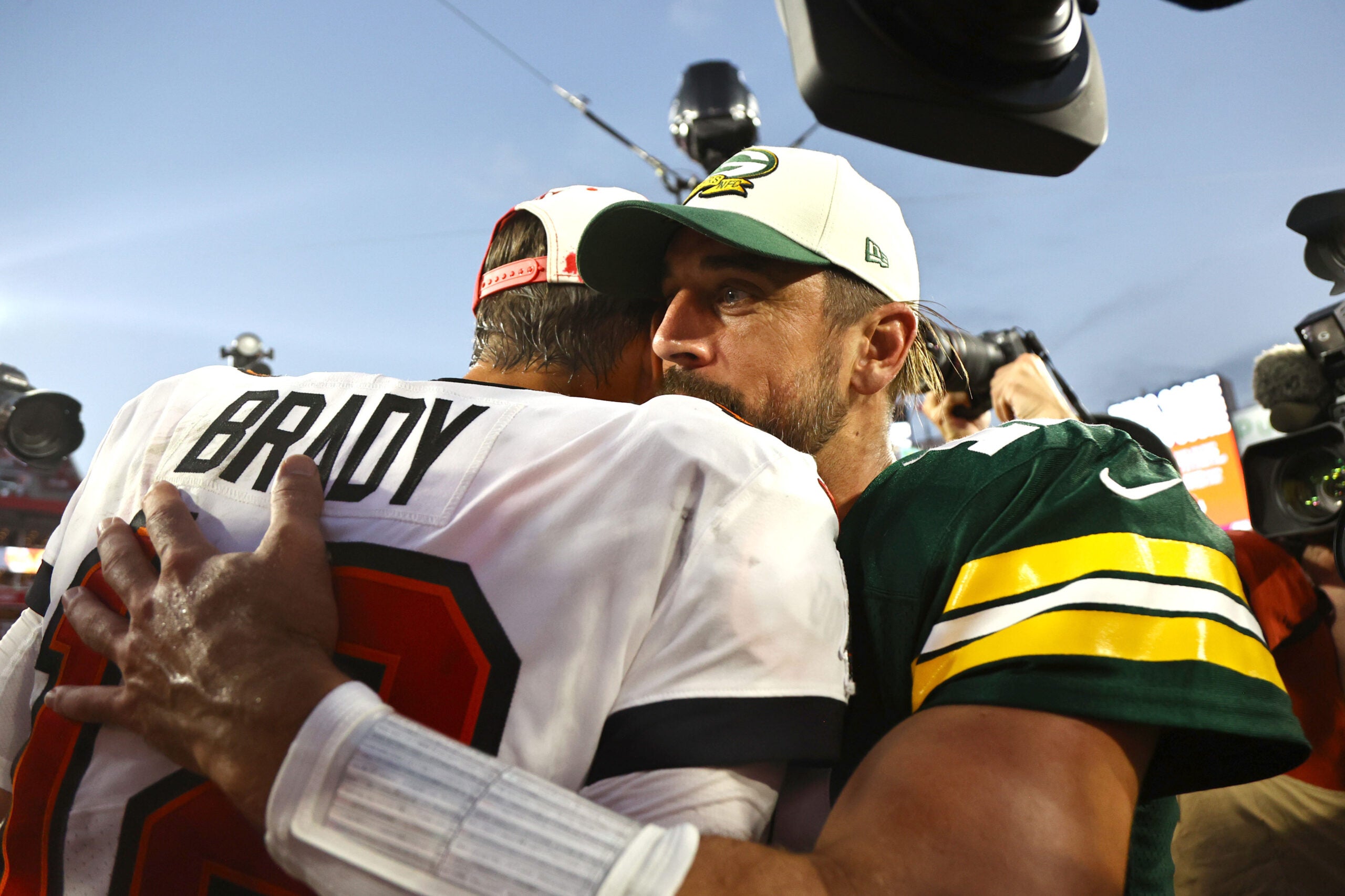 Sep 25, 2022; Tampa, Florida, USA; Tampa Bay Buccaneers quarterback Tom Brady (12) and Green Bay Packers quarterback Aaron Rodgers (12) greet after the game at Raymond James Stadium.