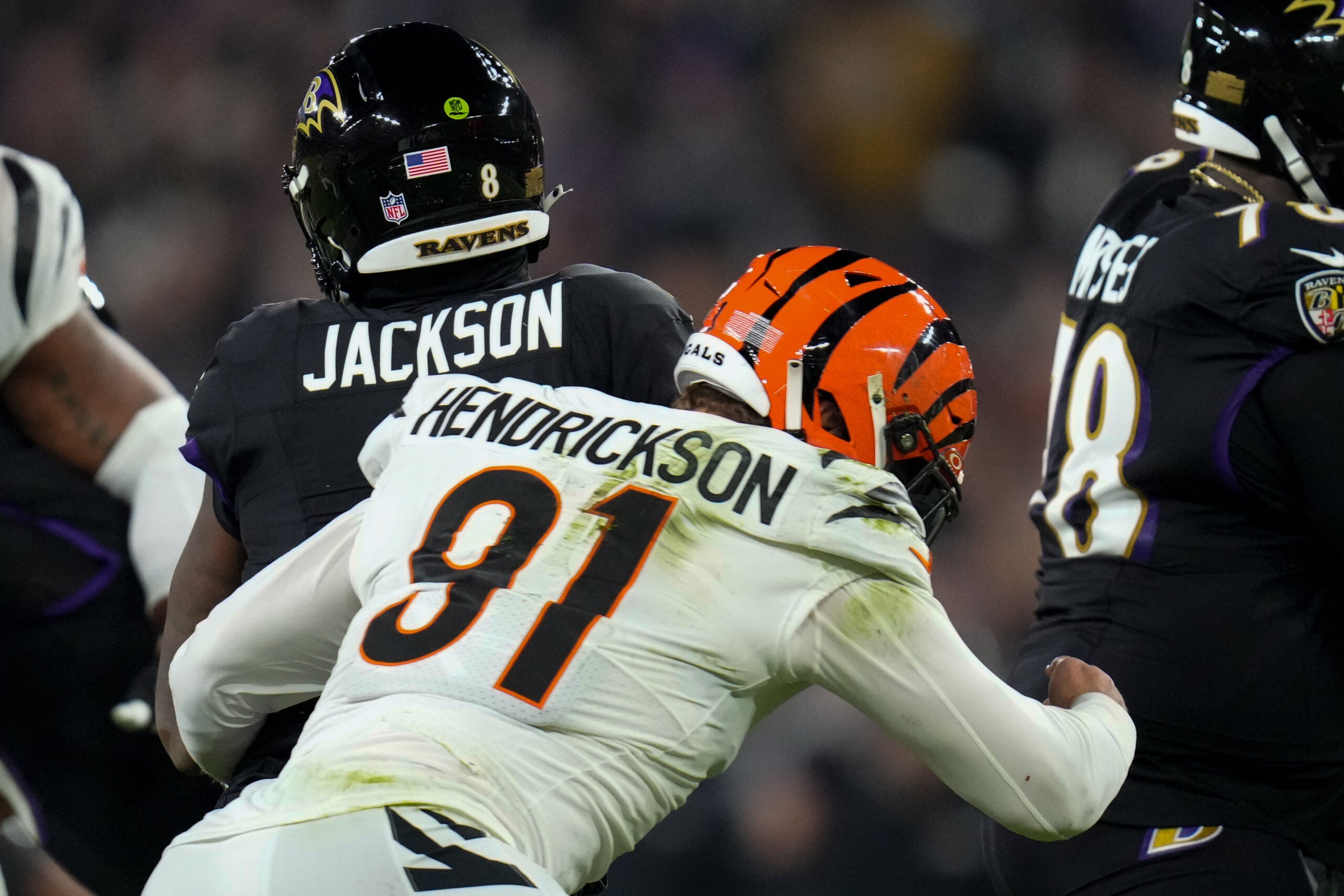 Nov 16, 2023; Baltimore, Maryland, USA; Cincinnati Bengals defensive end Trey Hendrickson (91) sacks Baltimore Ravens quarterback Lamar Jackson (8) in the first quarter at M&T Bank Stadium.
