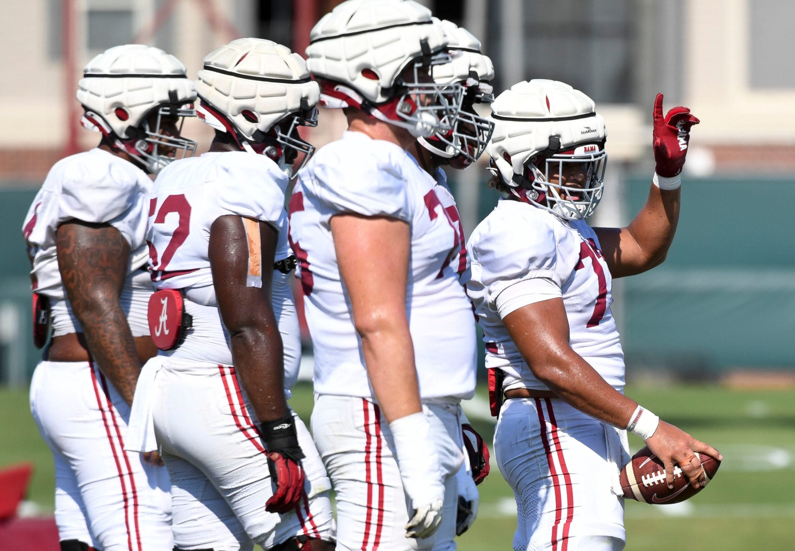 The Crimson Tide players and coaches continue working toward the season opener in practice Tuesday, Aug. 13, 2024. Alabama offensive lineman Parker Brailsford (72) signals as he prepares to lead the offensive line through a blocking drill.