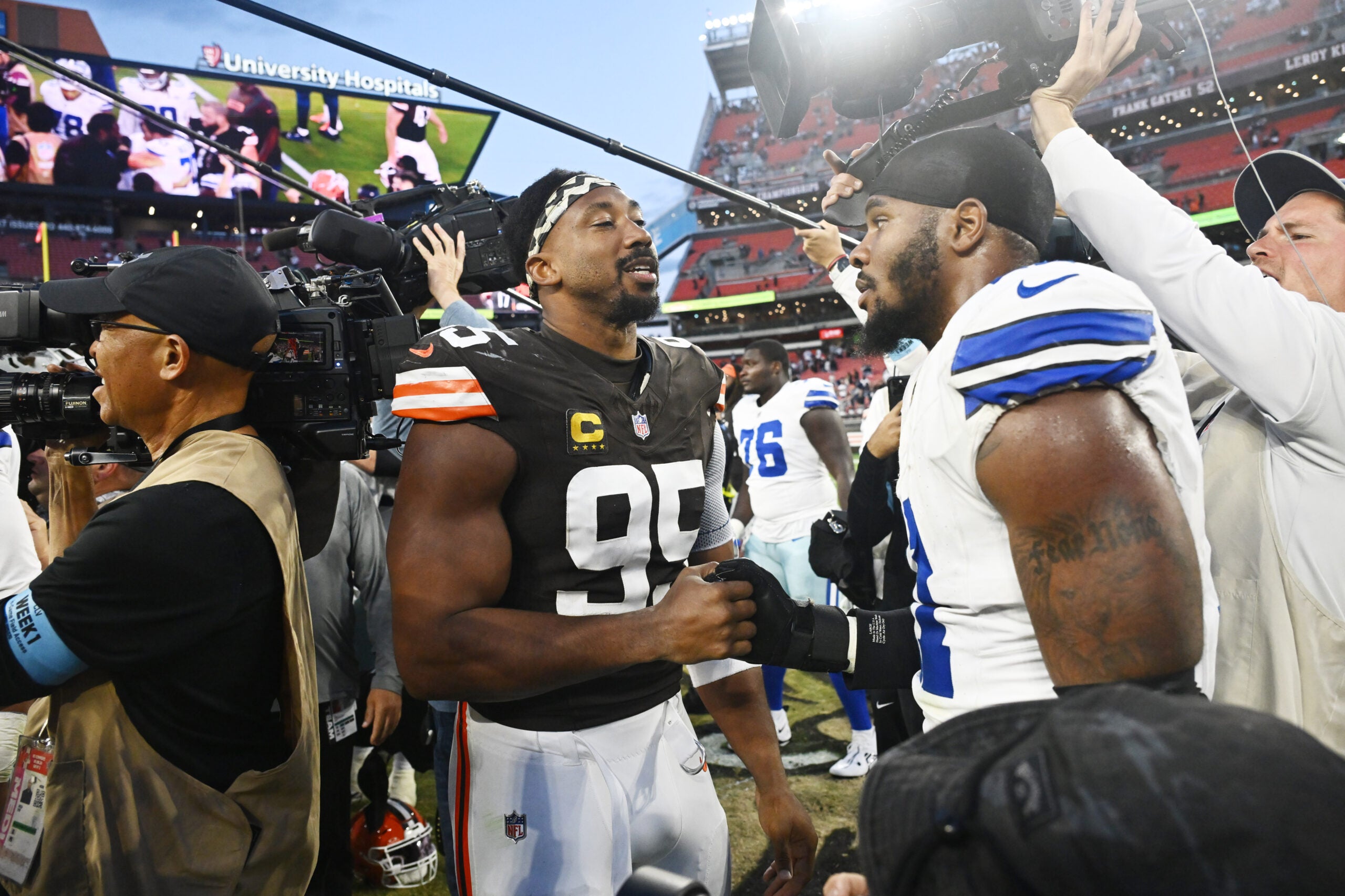 Sep 8, 2024; Cleveland, Ohio, USA; Cleveland Browns defensive end Myles Garrett (95) talks to Dallas Cowboys linebacker Micah Parsons (11) after the game at Huntington Bank Field.