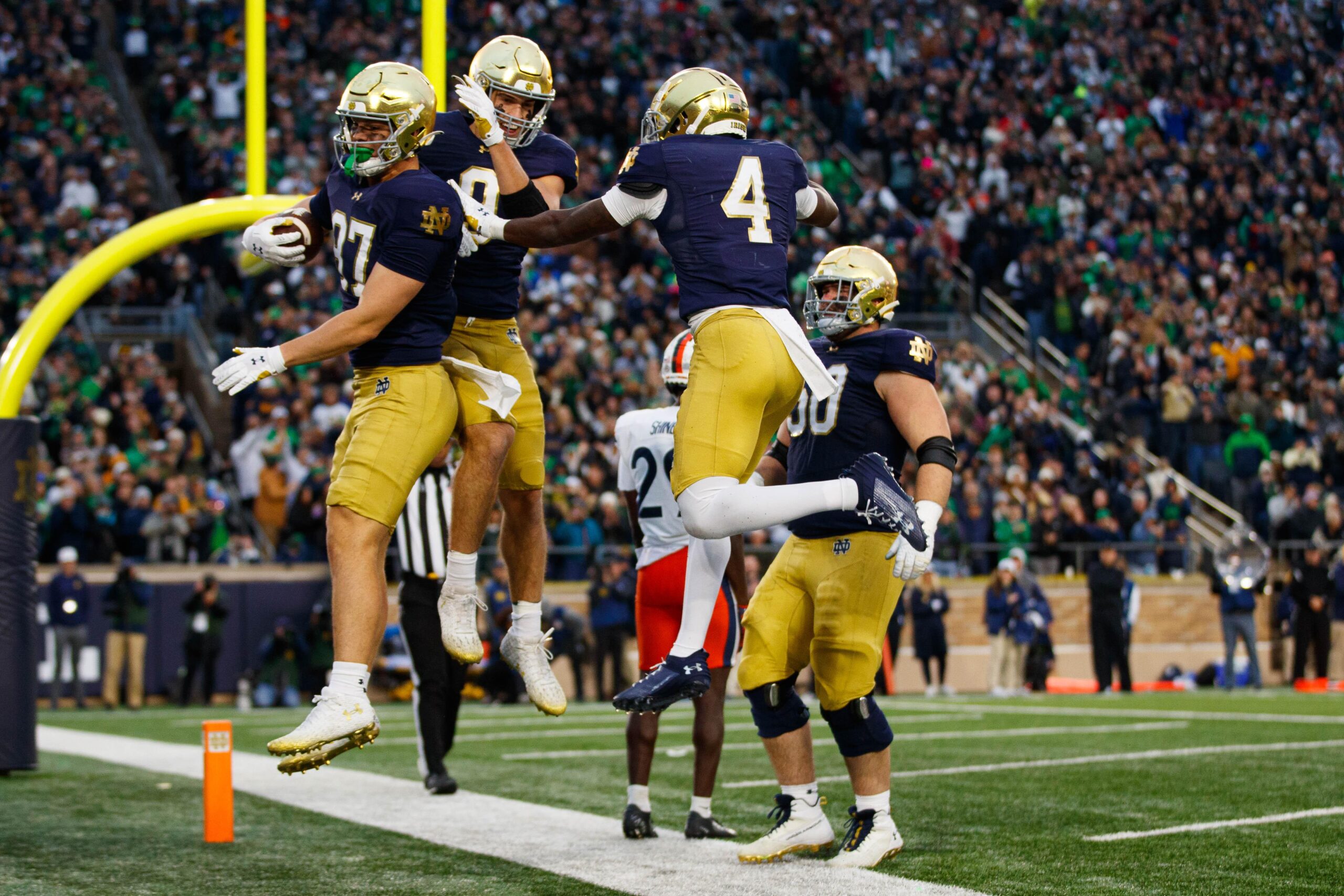 Notre Dame tight end Cooper Flanagan (87) celebrates with quarterback Kenny Minchey (8) after a Flanagan touchdown during a NCAA college football game against Virginia at Notre Dame Stadium on Saturday, Nov. 16, 2024, in South Bend.