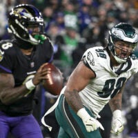 Dec 1, 2024; Baltimore, Maryland, USA; Philadelphia Eagles defensive tackle Jalen Carter (98) applies pressure on Baltimore Ravens quarterback Lamar Jackson (8) during the game at M&T Bank Stadium.