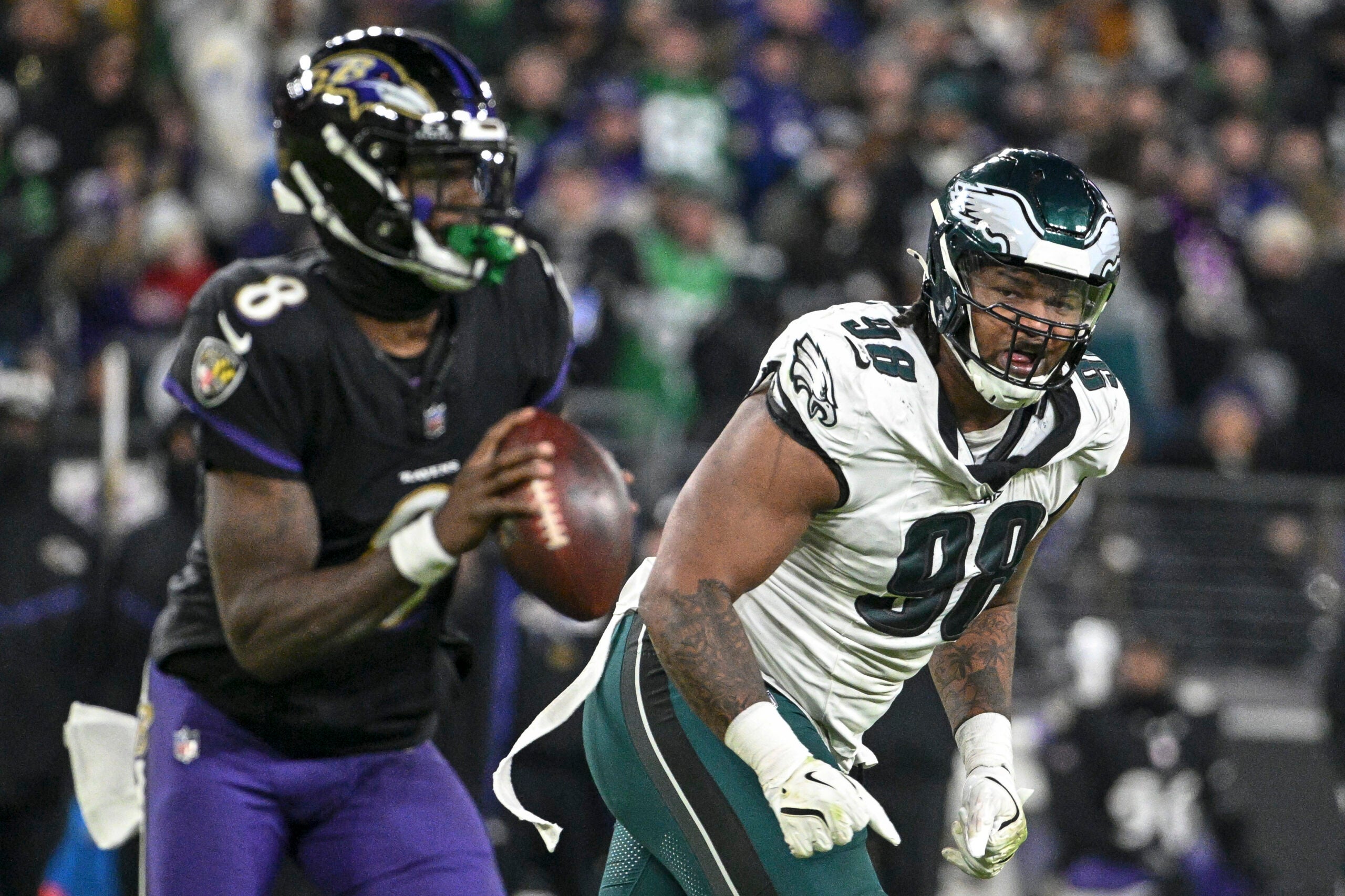 Dec 1, 2024; Baltimore, Maryland, USA; Philadelphia Eagles defensive tackle Jalen Carter (98) applies pressure on Baltimore Ravens quarterback Lamar Jackson (8) during the game at M&T Bank Stadium.