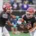 Louisville's quarterback Zavier Hunt (9) hands off to Zaiden Jernigan (8) during play against Louisville in the MHSAA 4A championship game in Hattiesburg, Miss., Saturday, Dec. 7, 2024.