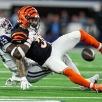 Dallas Cowboys linebacker DeMarvion Overshown takes down Cincinnati Bengals running back Chase Brown (30) Monday Night Football at AT&T Stadium in Arlington, Texas on Monday, December 9, 2024.