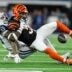 Dallas Cowboys linebacker DeMarvion Overshown takes down Cincinnati Bengals running back Chase Brown (30) Monday Night Football at AT&T Stadium in Arlington, Texas on Monday, December 9, 2024.