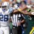 Indianapolis Colts running back Jonathan Taylor (28) stiff arms Green Bay Packers cornerback Jaire Alexander (23) on a first down run during their football game Sunday, September 15, 2024, at Lambeau Field in Green Bay, Wisconsin.