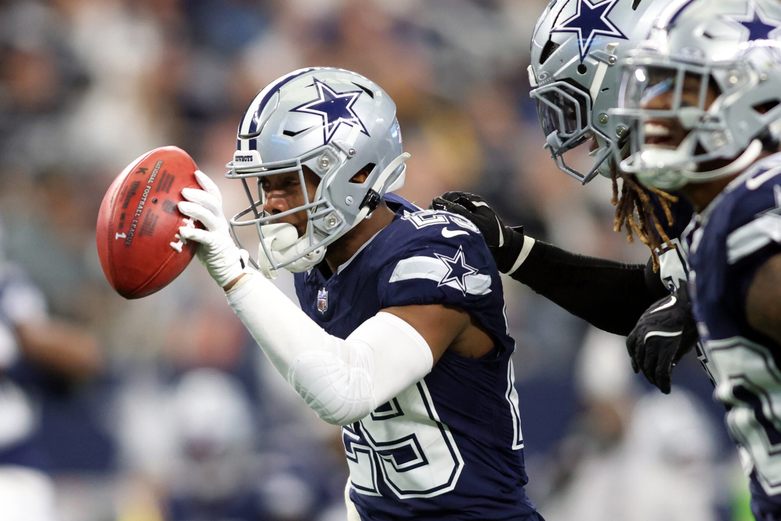 Jan 5, 2025; Arlington, Texas, USA; Dallas Cowboys cornerback C.J. Goodwin (29) recovers a fumble against the Washington Commanders during the second quarter at AT&T Stadium.