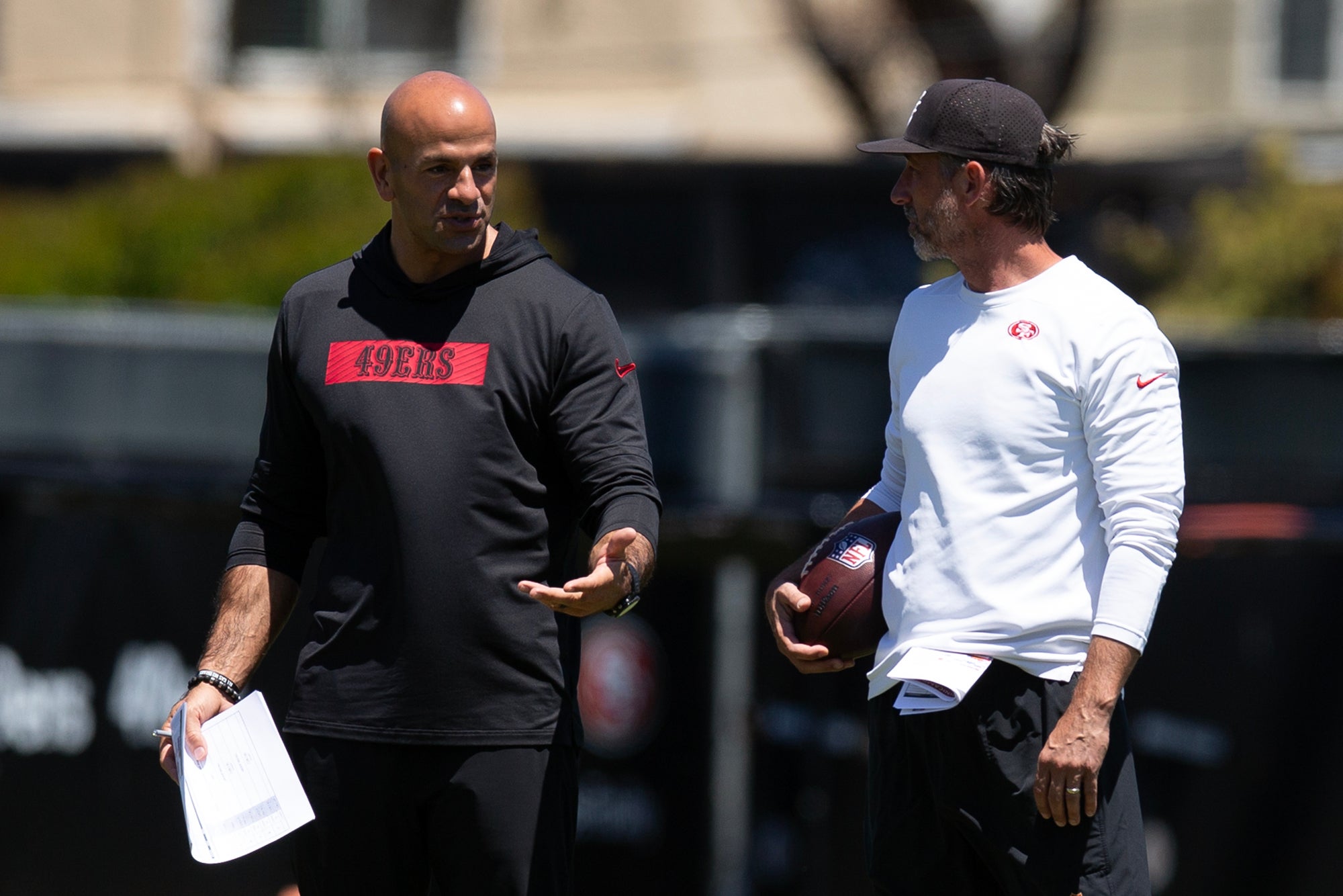May 9, 2025; Santa Clara, CA, USA; San Francisco 49ers head coach Kyle Shanahan, right, confers with defensive coordinator Robert Saleh during the team's rookie minicamp.