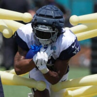 Jul 27, 2025; Oxnard, CA, USA; Dallas Cowboys running back Jaydon Blue (34) carries the ball at training camp at the River Ridge Fields.
