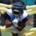Jul 27, 2025; Oxnard, CA, USA; Dallas Cowboys running back Jaydon Blue (34) carries the ball at training camp at the River Ridge Fields.