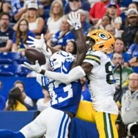 Aug 16, 2025; Indianapolis, Indiana, USA; Indianapolis Colts wide receiver Tyler Kahmann (43) breaks up a pass intended for Green Bay Packers wide receiver Isaiah Neyor (80) during the second half at Lucas Oil Stadium.