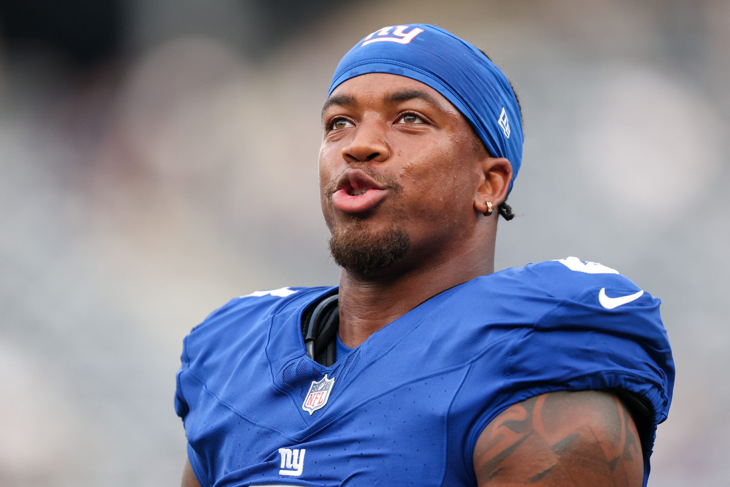 Aug 16, 2025; East Rutherford, New Jersey, USA; New York Giants safety Jevon Holland (8) looks on before the preseason game against the New York Jets at MetLife Stadium.