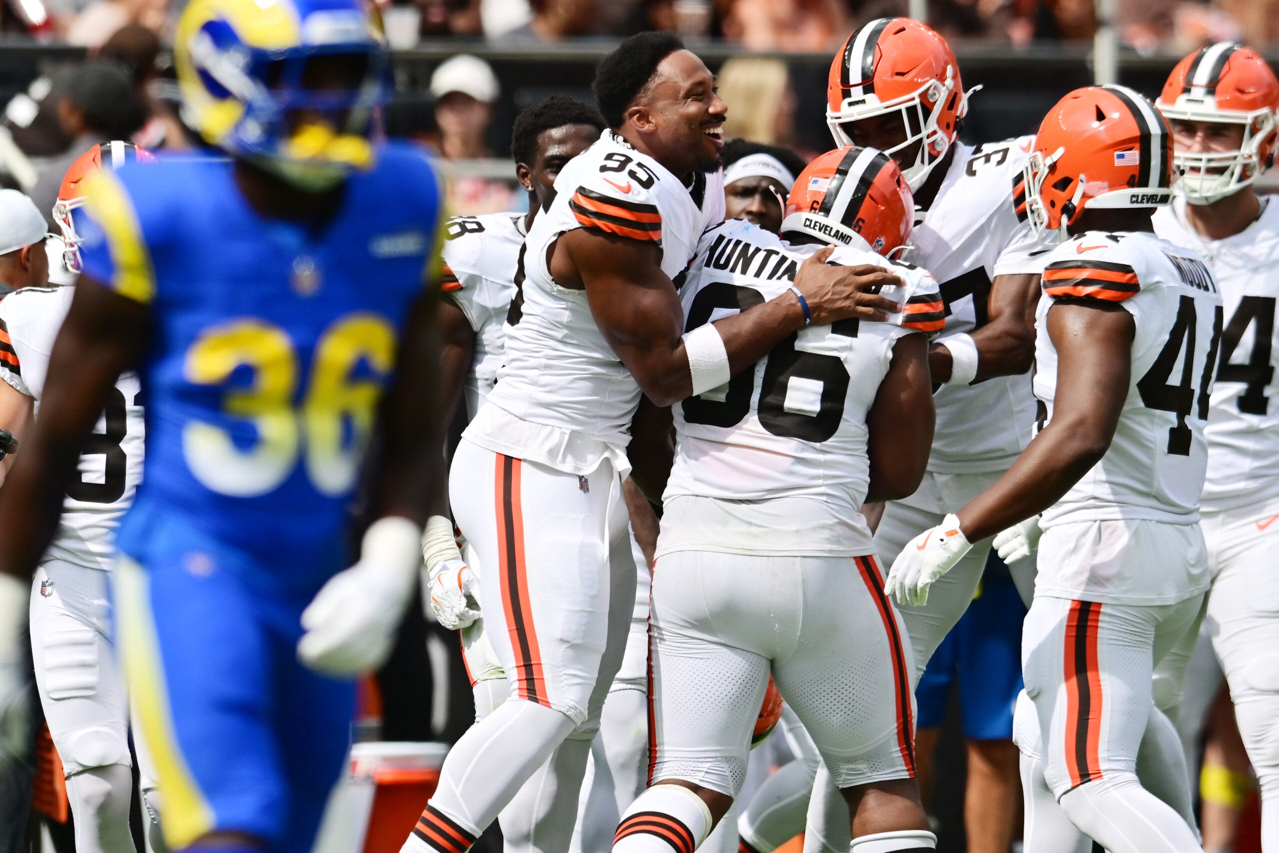 Aug 23, 2025; Cleveland, Ohio, USA; Cleveland Browns defensive end Myles Garrett (95) celebrates with defensive end Adin Huntington (66) after Huntington sacked Los Angeles Rams quarterback Dresser Winn (not pictured) during the second half at Huntington Bank Field.