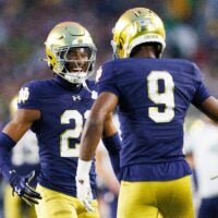 Notre Dame cornerback Karson Hobbs (21) and safety Tae Johnson (9) celebrate after getting a stop in the first half of a NCAA football game against Texas A&M at Notre Dame Stadium on Saturday, Sept. 13, 2025, in South Bend.