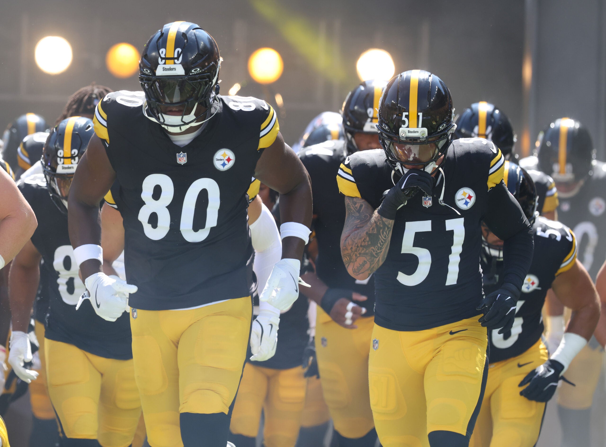 Sep 14, 2025; Pittsburgh, Pennsylvania, USA; Pittsburgh Steelers tight end Darnell Washington (80) and linebacker Nick Herbig (51) take the field against the Seattle Seahawks at Acrisure Stadium.
