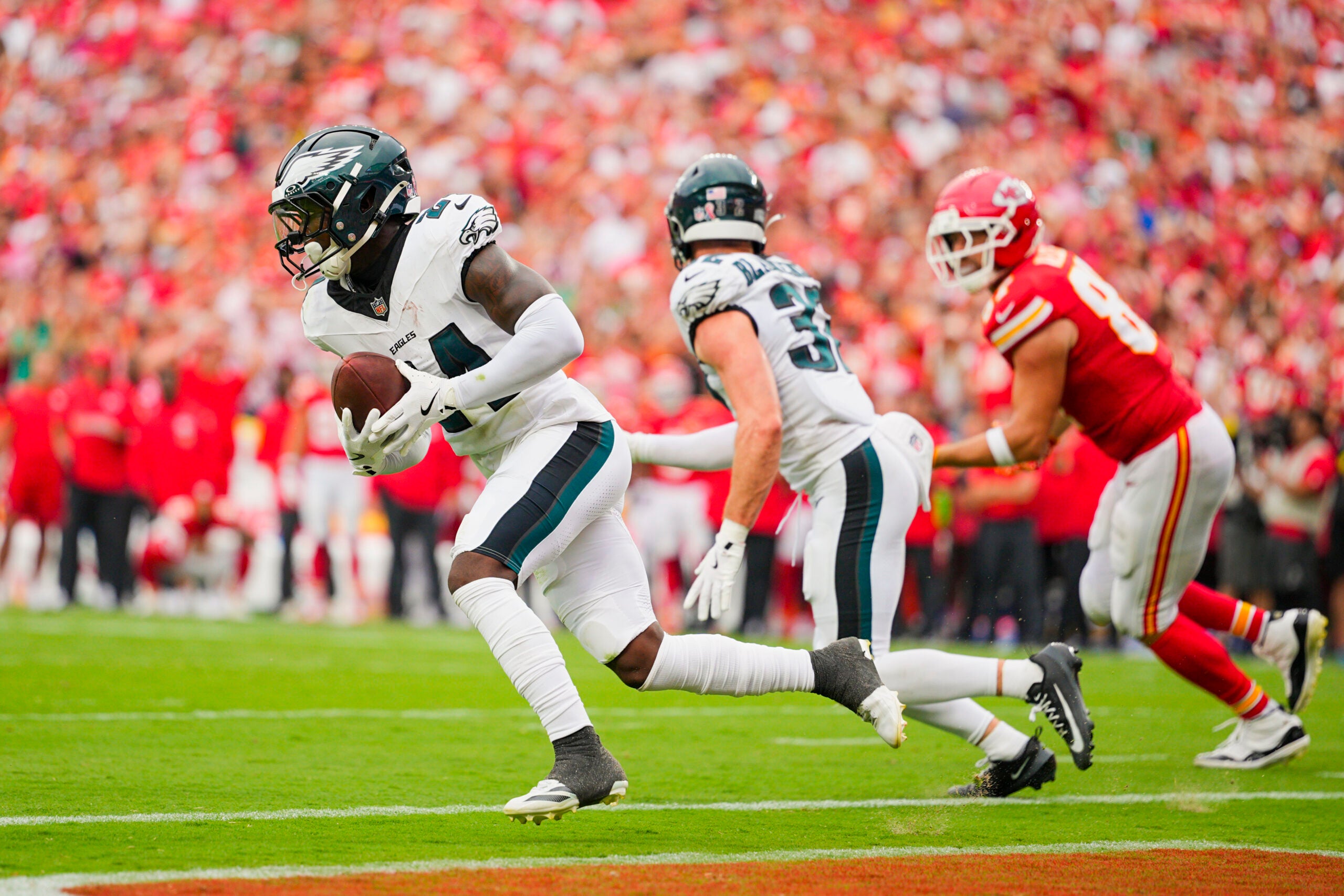 Sep 14, 2025; Kansas City, Missouri, USA; Philadelphia Eagles safety Andrew Mukuba (24) returns an interception a pass during the second half against the Kansas City Chiefs at GEHA Field at Arrowhead Stadium.