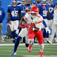 Sep 21, 2025; East Rutherford, New Jersey, USA; Kansas City Chiefs wide receiver Juju Smith-Schuster (9) runs against New York Giants cornerback Paulson Adebo (21) in the second quarter at MetLife Stadium.