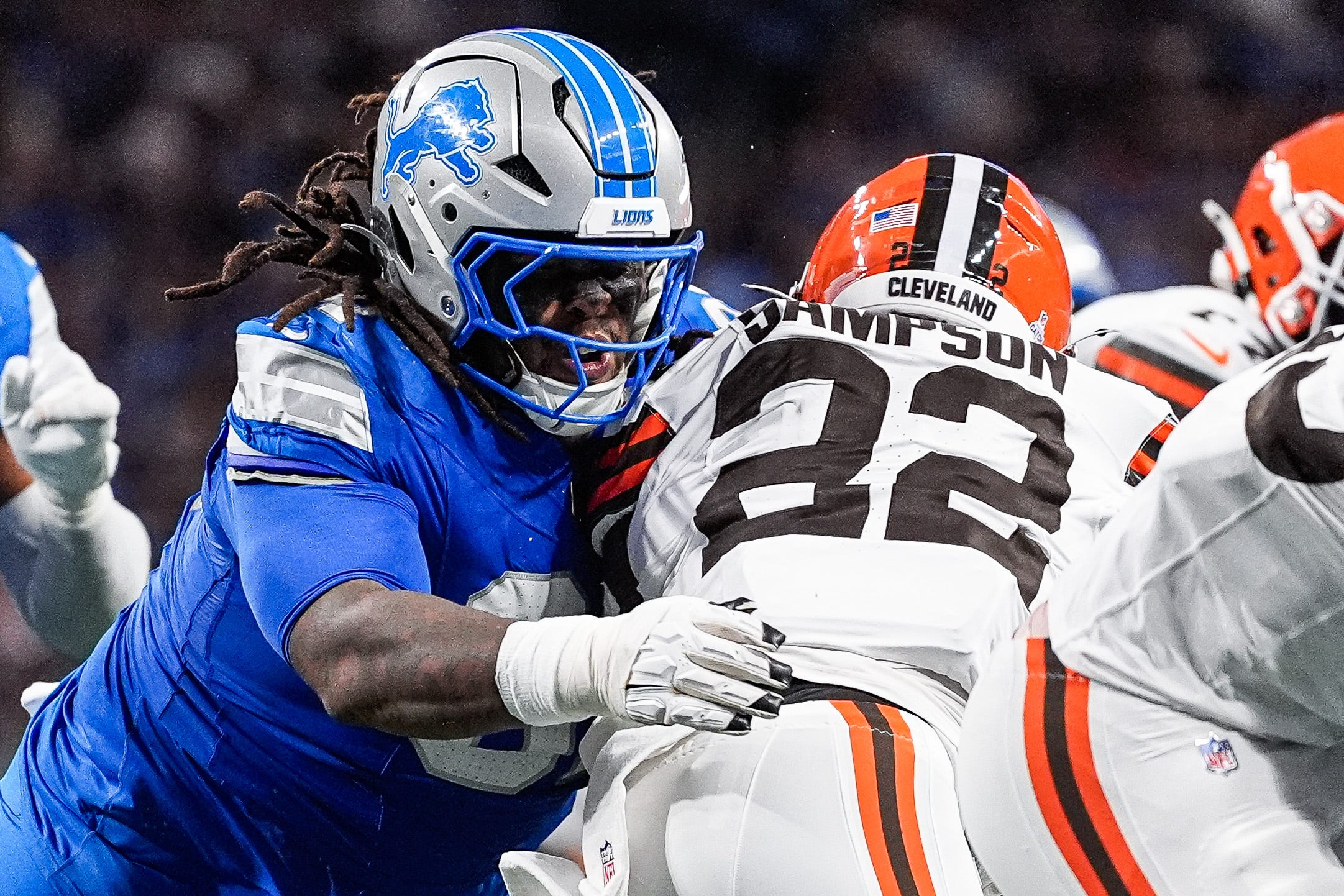 Detroit Lions defensive tackle Tyleik Williams (91) tackles Cleveland Browns running back Dylan Sampson (22) during the first half at Ford Field in Detroit on Sunday, Sept. 28, 2025.