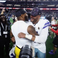 Sep 28, 2025; Arlington, Texas, USA; Dallas Cowboys quarterback Dak Prescott (4) and Green Bay Packers defensive end Micah Parsons (1) embrace after the game at AT&T Stadium.