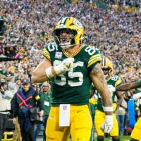 Oct 12, 2025; Green Bay, Wisconsin, USA; Green Bay Packers tight end Tucker Kraft (85) celebrates a touchdown in the fourth quarter against the Cincinnati Bengals at Lambeau Field.